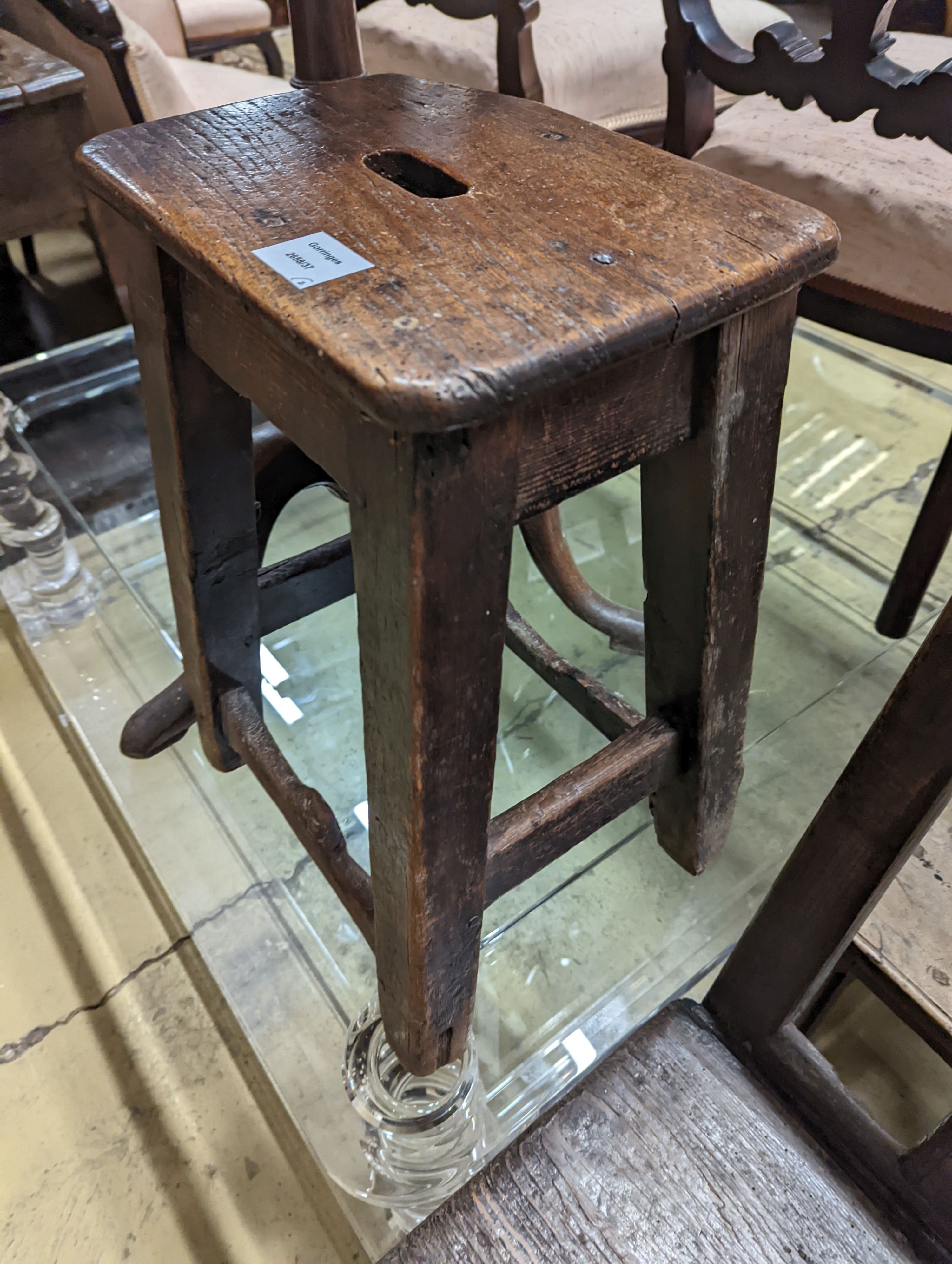 A 19th century oak stool and an oak tripod table, table diameter 53cm, 70cm height